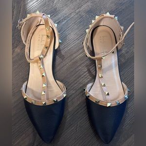 Black and tan studded pointed toe flats
